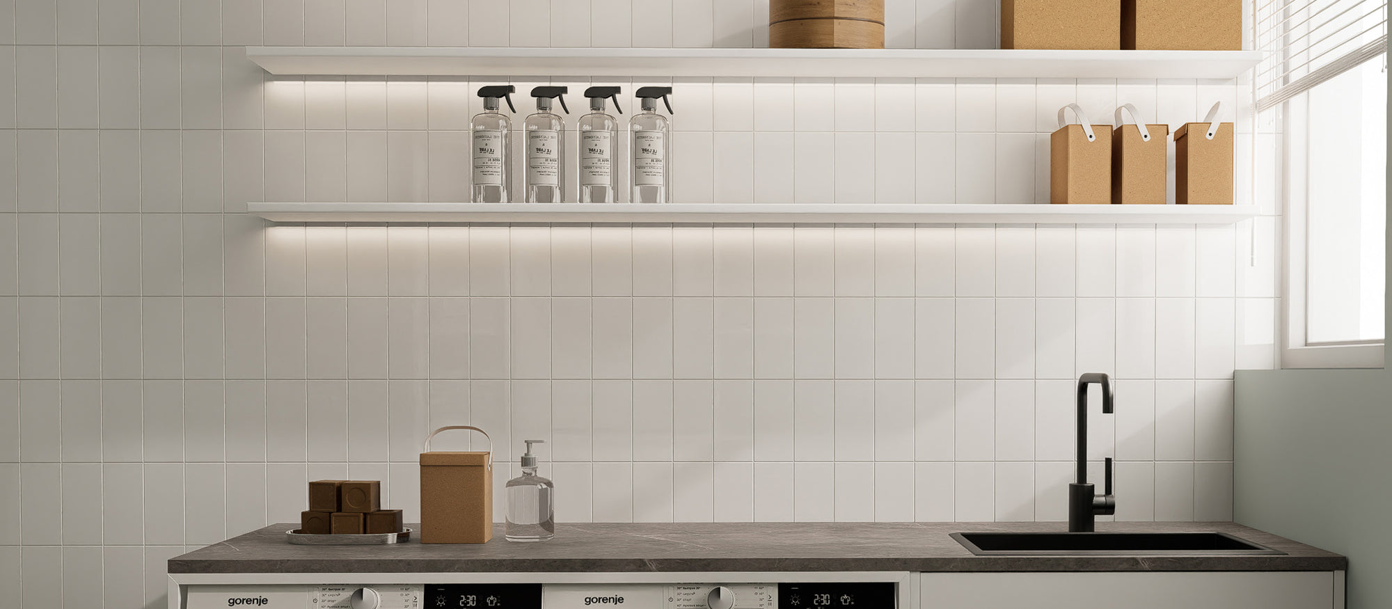 Glossy Pure White rectangle peel and stick backsplash tiles installed on a clean utility sink wall after installation