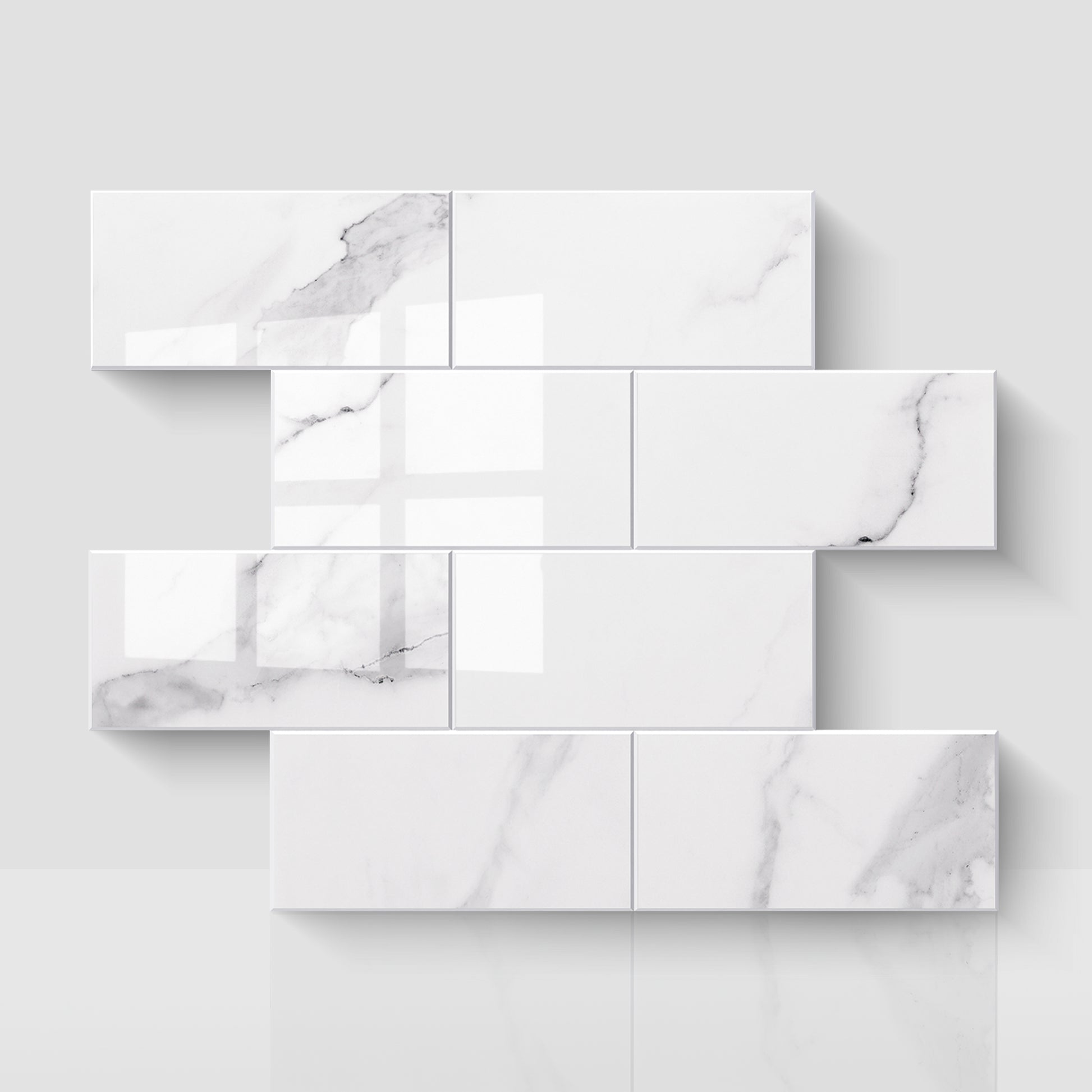 Glossy Carrara white subway peel and stick backsplash tiles in a staggered layout