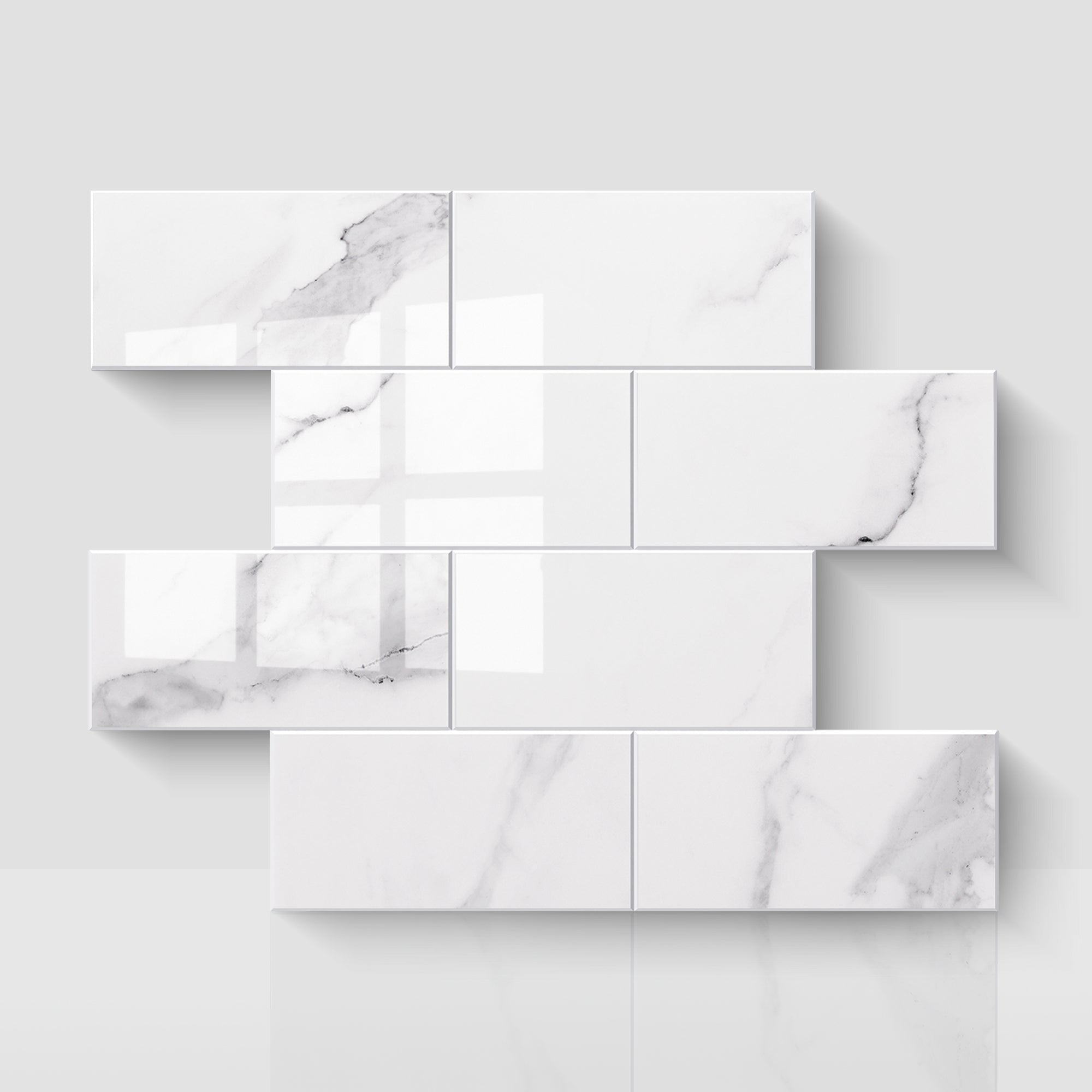 Glossy Carrara white subway peel and stick backsplash tiles in a staggered layout