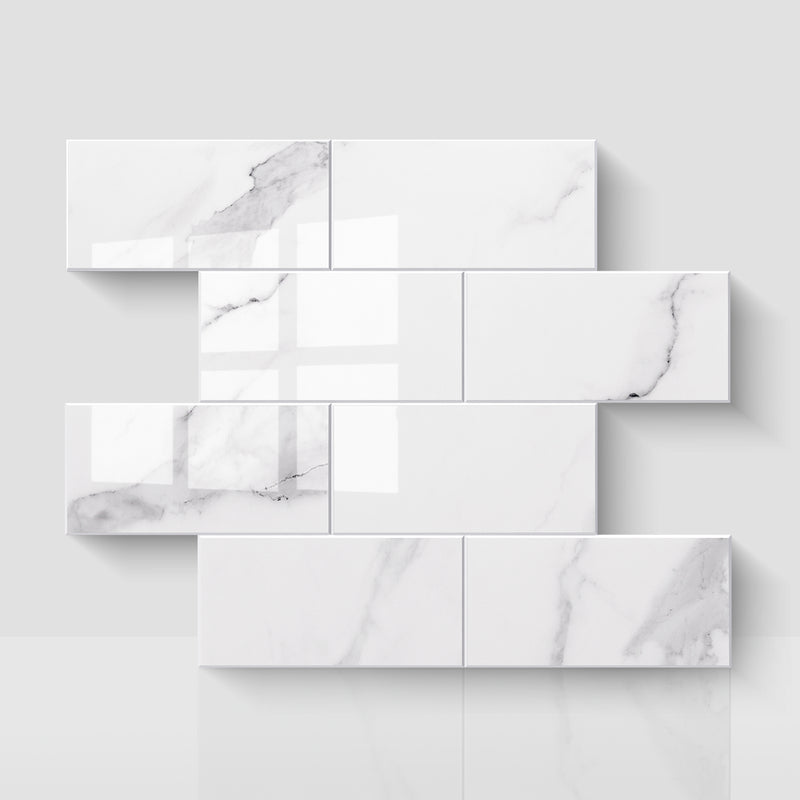 Glossy Carrara white subway peel and stick backsplash tiles in a staggered layout