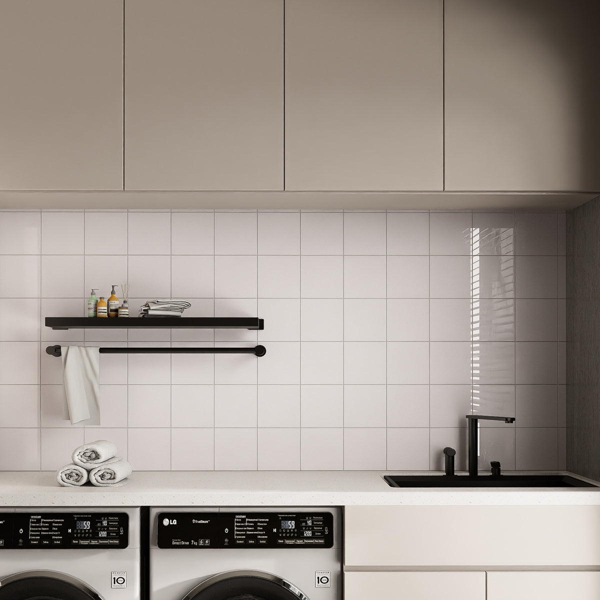Glossy Pure White rectangle peel and stick backsplash tiles installed on a clean laundry room wall with washer and sink area