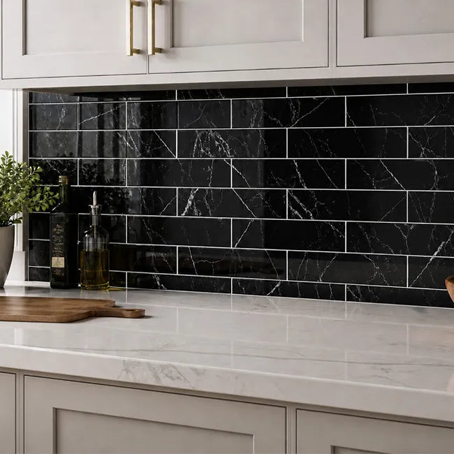 Glossy black marble peel and stick subway tile backsplash in modern white kitchen