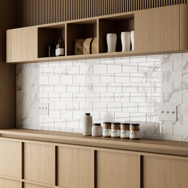 Glossy Carrara white subway tile backsplash with wood shelves and pantry jars