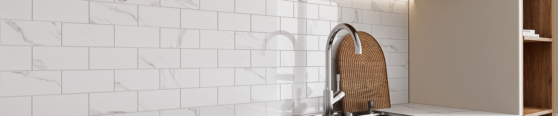DiYoZone glossy Carrara white peel and stick backsplash tiles installed behind a modern kitchen sink for easy home upgrades