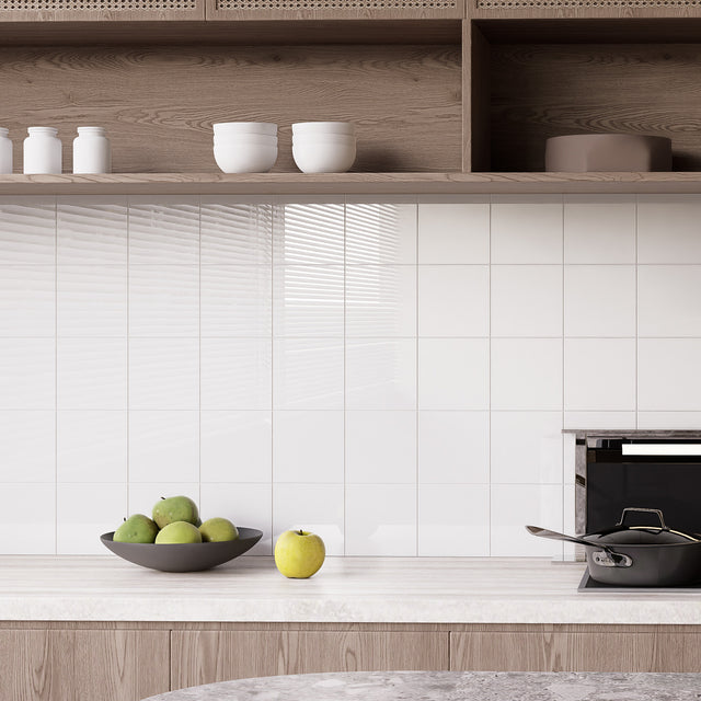 Glossy Pure White square peel and stick backsplash tiles installed on a bright kitchen backsplash wall